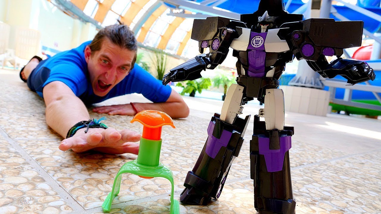 Roboty-Transformery-Megatron-ili-Optimus-Video-shou-Akvatim
