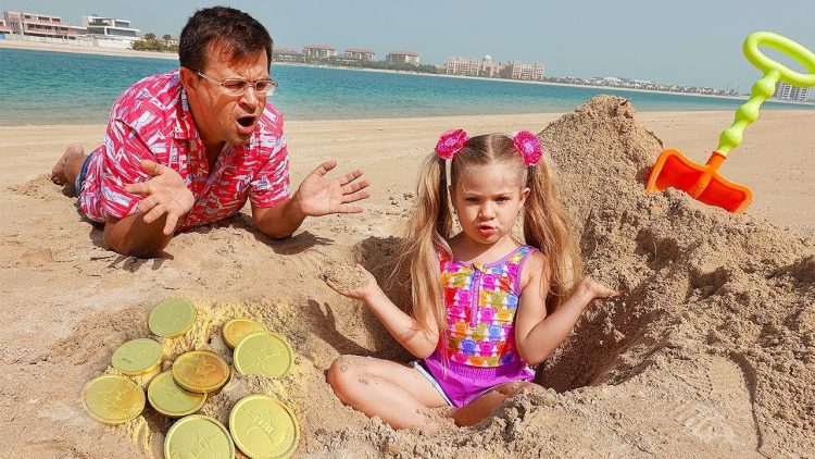 Diana-and-Roma-play-on-the-Beach-with-Dad